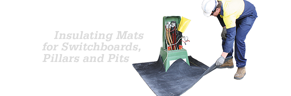 Worker placing an insulating mat around switchboard equipment for pillars and pits